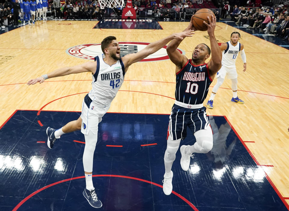 Houston Rockets guard Eric Gordon (10) shoots as Dallas Mavericks forward Maxi Kleber (42) defends during the first half of an NBA basketball game Friday, Jan. 7, 2022, in Houston. (AP Photo/Eric Christian Smith)