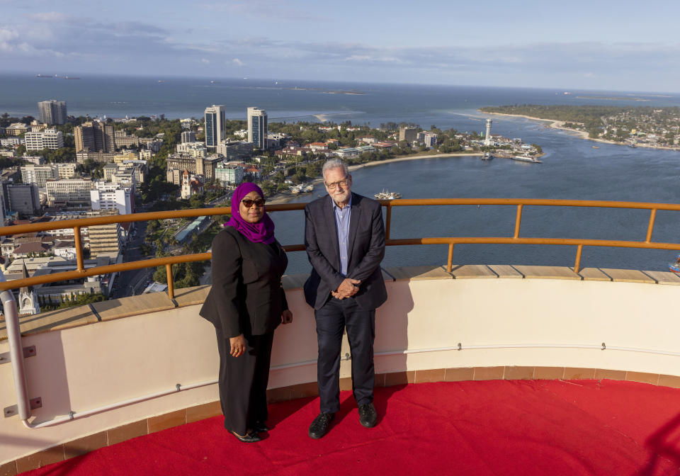 Tanzanian President Samia Suluhu Hassan, left, appears with journalist Peter Greenberg at the top of a skyscraper in Dar es Salaam, Tanzania for the television show “The Royal Tour.” Greenberg is resuming the series that shows off the best tourist spots of a country and features the nation’s leader as the tour guide. (Karen Ballard via AP)