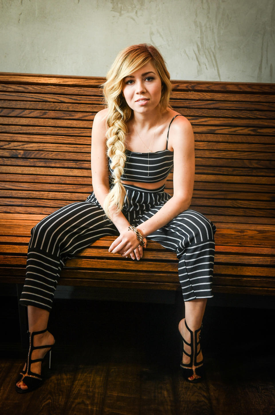 Jennette sitting on a bench