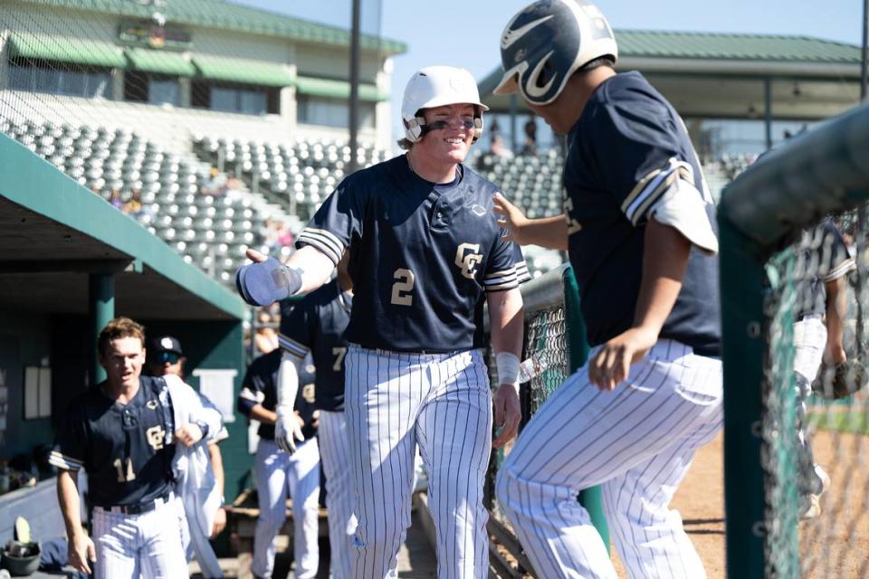 Central Catholic’s Xavier Diep drove home the go-ahead run and is greeted by Seth Van Dyk who scored from third during game with Gregori in the Modesto Nuts High School Baseball Showcase at John Thurman Field in Modesto, Calif., Saturday, March 16, 2024.