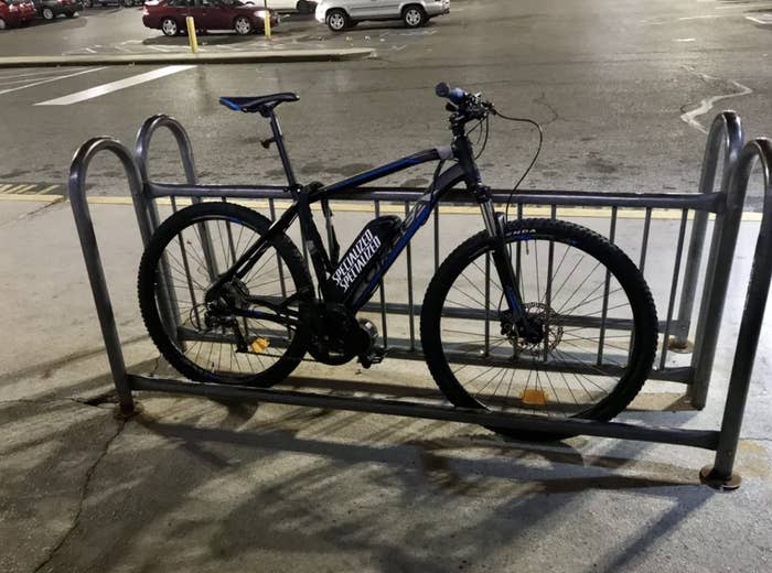 A bike chained to a bike rack