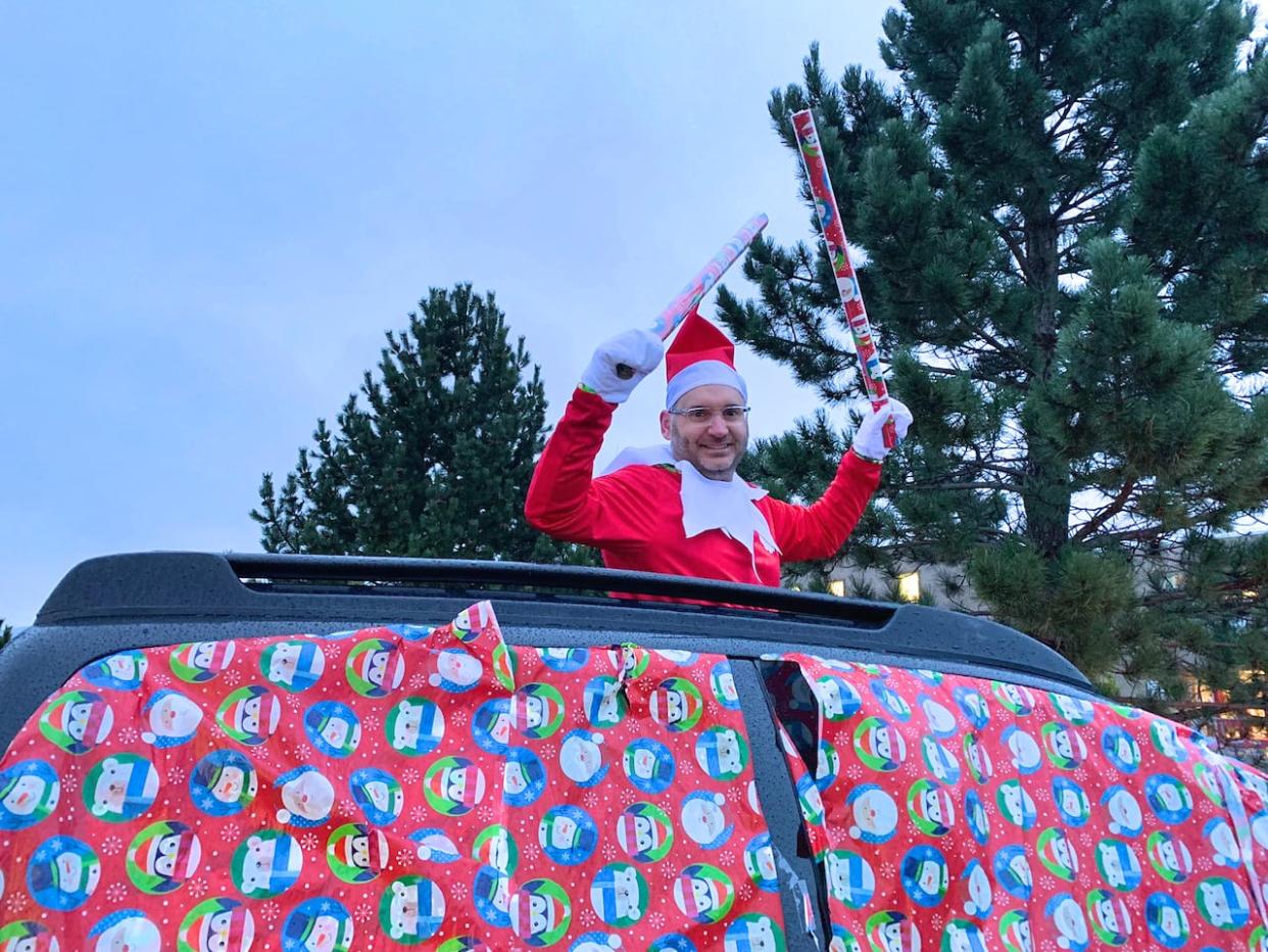 Andrew Burke — dressed as C.C. the elf — has gone all out this December surprising the students at C.C. Loughlin each morning. (Bernice Hillier/CBC - image credit)