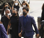 FILE - Former "Empire" actor Jussie Smollett, right, arrives the George N. Leighton Criminal Court Building for a hearing on, Wednesday, July 14, 2021, in Chicago. Smollett is going on trial this week, accused of lying to police when he reported he was the victim of a racist, homophobic attack downtown Chicago nearly three years ago. Jury selection is scheduled for Monday, Nov. 29, 2021. (Stacey Wescott/Chicago Tribune via AP, File)