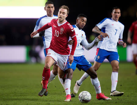 Soccer - International Friendly - Denmark vs Panama - Broendby stadium, Copenhagen, Denmark - March 22, 2018. Denmark's Christian Eriksen and Panama's Edgar Barcenas are seen in action. Ritzau Scanpix/Liselotte Sabroe via REUTERS