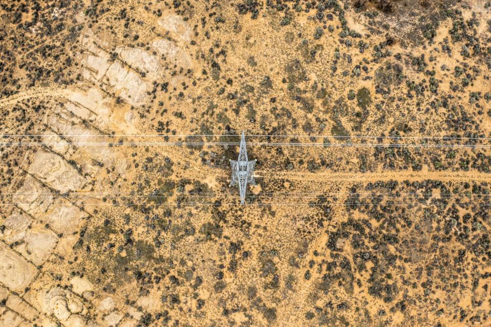 An aerial view of electric transmission lines passing through Roosevelt, Utah.