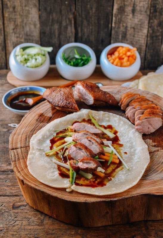 <p>The Woks of Life</p><p>This easy Peking duck recipe features crispy duck breast ans homemade Mandarin pancakes. Impress guests with a Peking duck dinner that's easier than it looks!</p><p><strong>Get the recipe: <a href="https://thewoksoflife.com/easy-peking-duck-mandarin-pancakes/" rel="nofollow noopener" target="_blank" data-ylk="slk:Easy Peking Duck with Mandarin Pancakes;elm:context_link;itc:0;sec:content-canvas" class="link ">Easy Peking Duck with Mandarin Pancakes</a></strong></p>