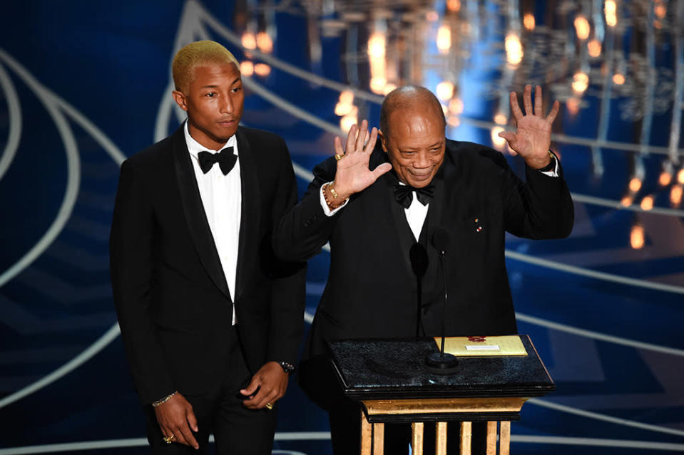 Pharrell Williams and Quincy Jones speak onstage during the 88th Annual Academy Awards at the Dolby Theatre on February 28, 2016 in Hollywood, California.  