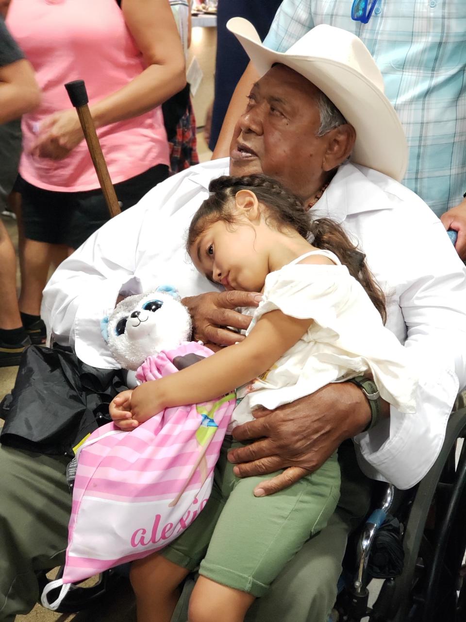 Arturo Andrade, 81, holding his granddaughter, Alexia, was one of the many Hispanic victims of COVID-19 in California.