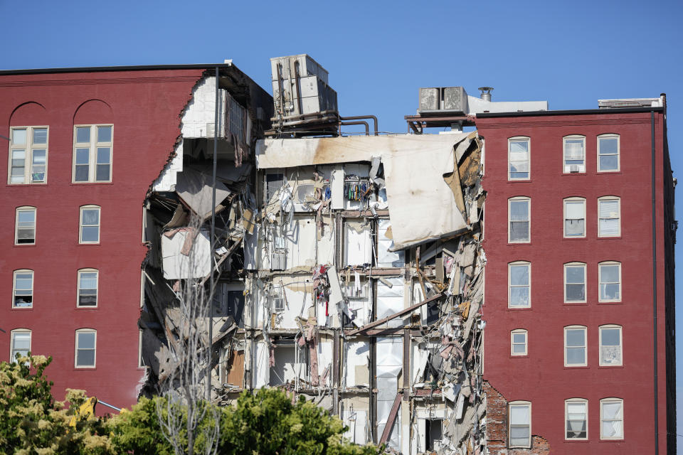 An apartment building that partially collapsed on Sunday afternoon can be seen Tuesday, May 30, 2023, in Davenport, Iowa. Five residents of the six-story apartment building that partially collapsed remained unaccounted for Tuesday, and authorities feared at least two of them might be stuck inside rubble that was too dangerous to search. (AP Photo/Erin Hooley)