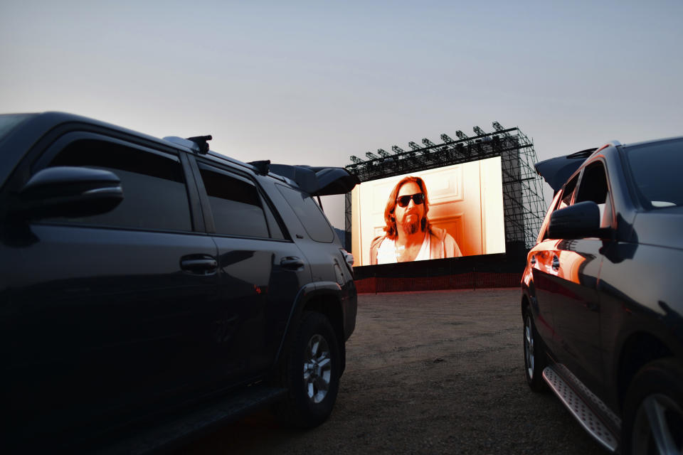 MORRISON, CO - AUGUST 22:  A screen shows The Big Lebowski during a drive-in movie on August 22, 2020 at the Red Rocks Amphiteatre in Morrison, Colorado. The famed concert locale features physically distanced summer creative planning of weekend yoga and a drive-in movie theater during the coronavirus pandemic.  (Photo by Mark Makela/Getty Images)