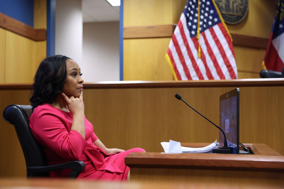 ATLANTA, GA - FEBRUARY 15: Fulton County District Attorney Fani Willis takes the stand as a witness during a hearing in the case of the State of Georgia v. Donald John Trump at the Fulton County Courthouse on February 15, 2024 in Atlanta, Georgia. Judge Scott McAfee is hearing testimony as to whether Willis and Special Prosecutor Nathan Wade should be disqualified from the case for allegedly lying about a personal relationship. (Photo by Alyssa Pointer-Pool/Getty Images)