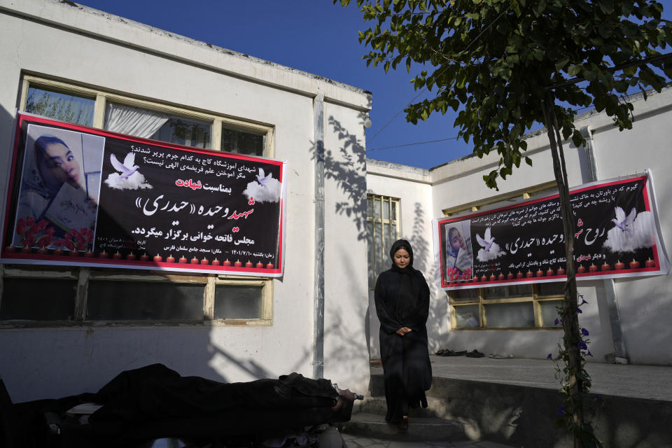 CORRECTS AGE OF VAHIDA HEYDARI TO 20 NOT 19 - The family of 20-year-old Vahida Heydari, who was a victim of a suicide bombing on a Hazara education center, prepares their home for a mourning ceremony, in Kabul, Afghanistan, Sunday, Oct. 2, 2022. Last week’s suicide bombing at the Kabul education center killed as many as 52 people, more than double the death toll acknowledged by Taliban officials, according to a tally compiled by The Associated Press on Monday. (AP Photo/Ebrahim Noroozi)