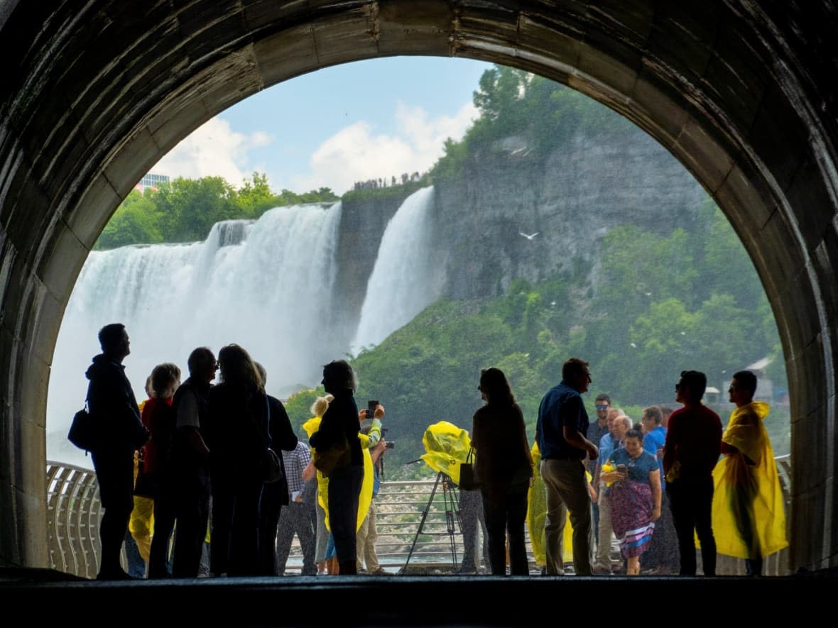 People arrive at a viewing platform on June 28 at Niagara Parks Power Station's Tunnel, a new attraction that offers breathtaking views of Niagara Falls. (Carlos Osorio/Reuters - image credit)