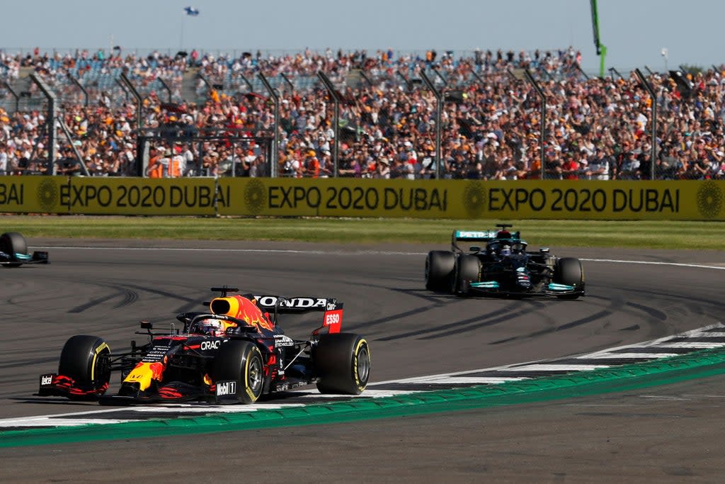 Max Verstappen leads Lewis Hamilton ahead of winning the Sprint race at Silverstone  (AFP via Getty Images)