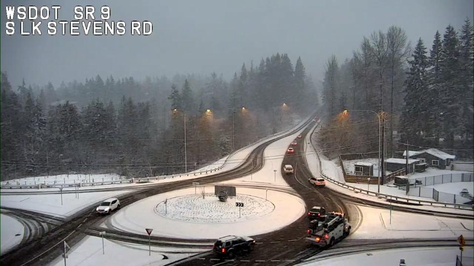 Washington State Department of Transportation cameras showed snow falling around Western Washington Wednesday.