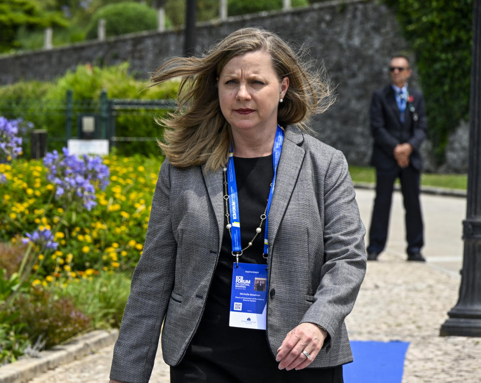 Michelle Bowman, a Federal Reserve governor, walks in a garden at an event.