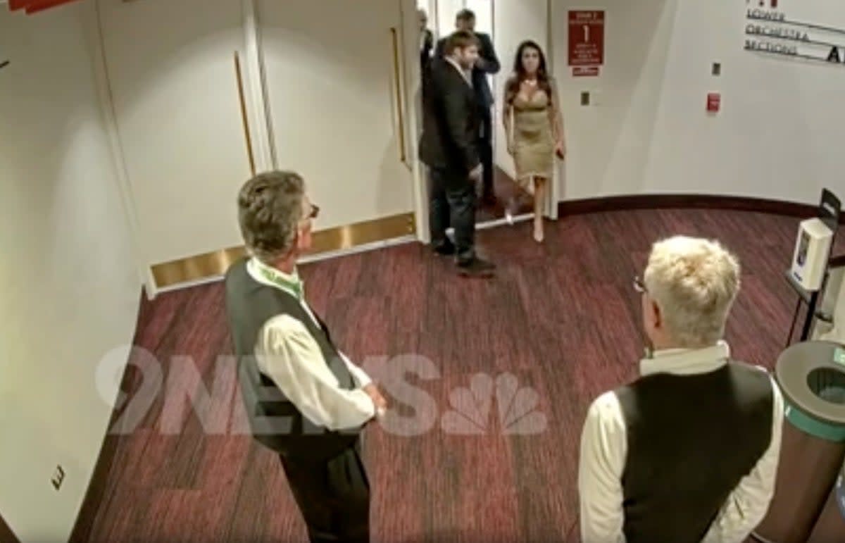 Lauren Boebert is seen being escorted out of theatre (9News)