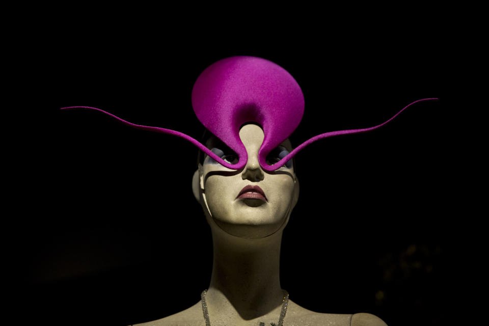 The Philip Treacy "Shocking Pink Roswell Hat" is displayed at the press view of the "Isabella Blow: Fashion Galore!" exhibition in London, Tuesday, Nov. 19, 2013. The exhibition, which runs from November 20 to March 2, celebrates the life and wardrobe of the late British patron of fashion and art who discovered many young fashion design talents. (AP Photo/Matt Dunham)