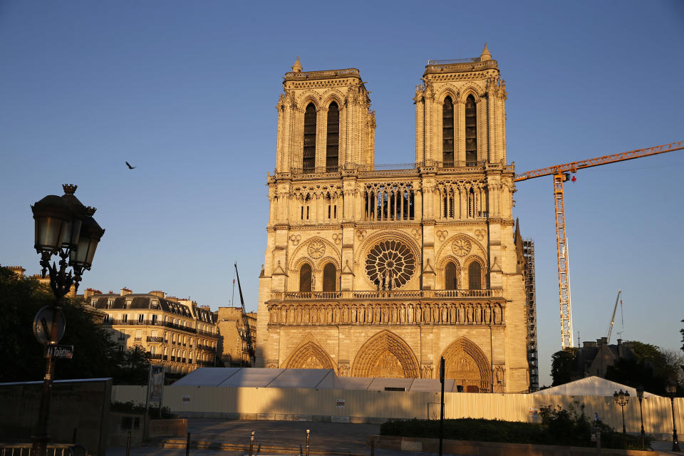 Notre-Dame cathedral is seen at sunset after repair work stops due to the coronavirus (COVID 19) outbreak one year after fire ravaged the emblematic monument as the coronavirus lockdown continues on April 14, 2020 in Paris, France. April 15 marks the first anniversary of the fire at Notre Dame destroying many parts of the Gothic cathedral. The coronavirus pandemic has spread to many countries across the world, claiming over 125,000 lives and infecting over 1.9 million people. (Photo by Chesnot/Getty Images)