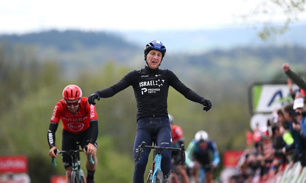 <span>Stephen Williams of the Israel-Premier Tech team celebrates at the finish line. </span><span>Photograph: Dario Belingheri/Getty Images</span>