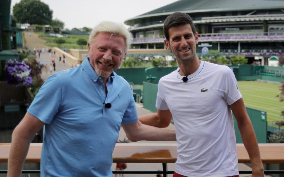Novak Djokovic of Serbia, right, poses for a television camera during an interview with former tennis champion Boris Becker, left, ahead of the start of the Wimbledon Tennis Championships in London, Sunday, July 1, 2018. The Championships will start on Monday, July 2. - AP