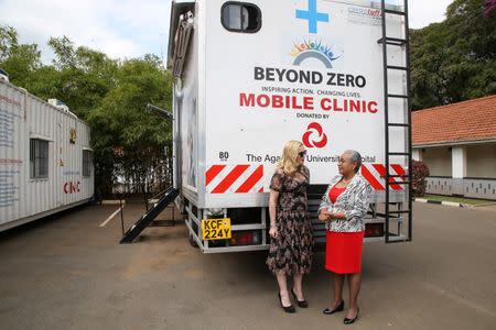 Singer-songwriter Madonna Ciccone (L) talks to Kenyan First Lady Margaret Kenyatta in front of a "Beyond Zero" mobile clinic at State House in Nairobi, Kenya, July 4, 2016. REUTERS/Presidential Press Service/Handout via REUTERS