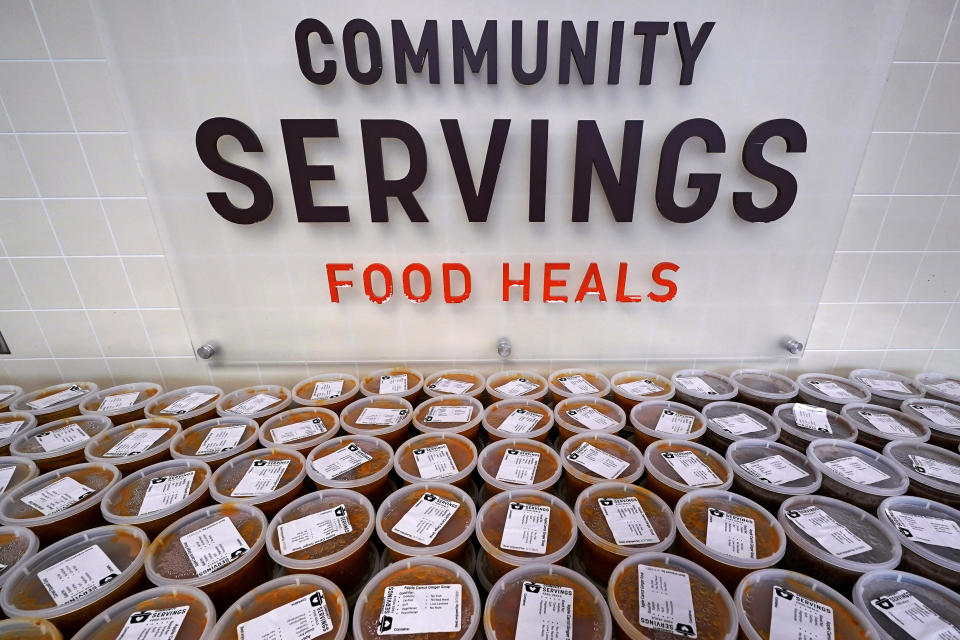 Hundreds of containers of soup are prepared for clients at Community Servings, which prepares and delivers scratch-made, medically tailored meals to individuals & families living with critical & chronic illnesses, Tuesday, Jan. 12, 2021, in the Jamaica Plain neighborhood of Boston. Food is a growing focus for insurers as they look to improve the health of the people they cover and cut costs. Insurers first started covering Community Servings meals about five years ago, and CEO David Waters says they now cover close to 40%. (AP Photo/Charles Krupa)