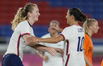 United States' Samantha Mewis, left, celebrates with teammate Carli Lloyd after scoring against Netherlands during a women's quarterfinal soccer match at the 2020 Summer Olympics, Friday, July 30, 2021, in Yokohama, Japan. (AP Photo/Silvia Izquierdo)