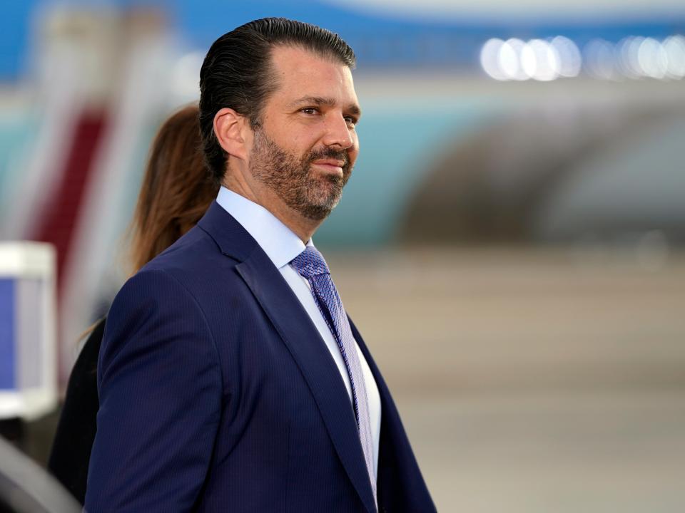 <p>Donald Trump Jr. waits for President Donald Trump and First Lady Melania Trump to arrive and board Air Force One </p> (AP)