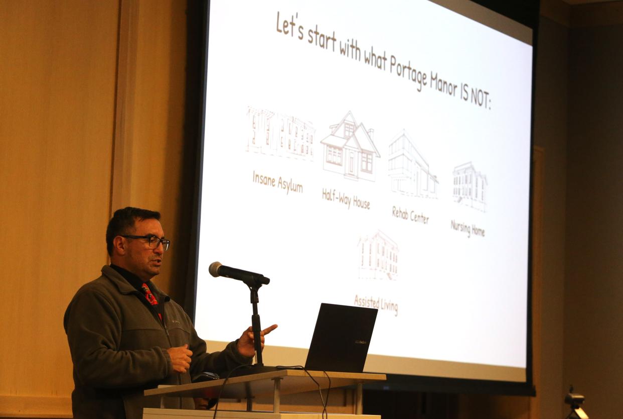 Roy Saenz, whose brother is a resident at Portage Manor, speaks Monday, March 6, 2023, at the Save Portage Manor town hall at the St. Joseph County Public Library sponsored by the local chapter of the NAACP.