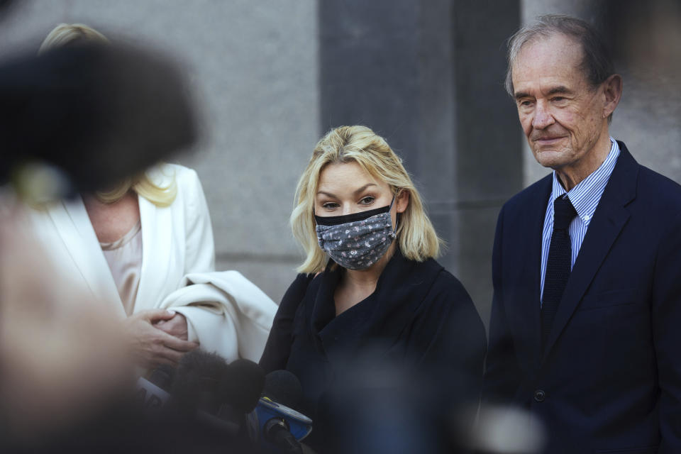 Accuser Danielle Bensky, center, with attorney David Boies, speaks following Ghislaine Maxwell's appearance in Federal Court on Friday, April 23, 2021, in New York. Ghislaine Maxwell, a British socialite and one-time girlfriend of Epstein, pleaded not guilty to sex trafficking conspiracy and an additional sex trafficking charge that were added in a rewritten indictment released last month by a Manhattan federal court grand jury. (AP Photo/Kevin Hagen)