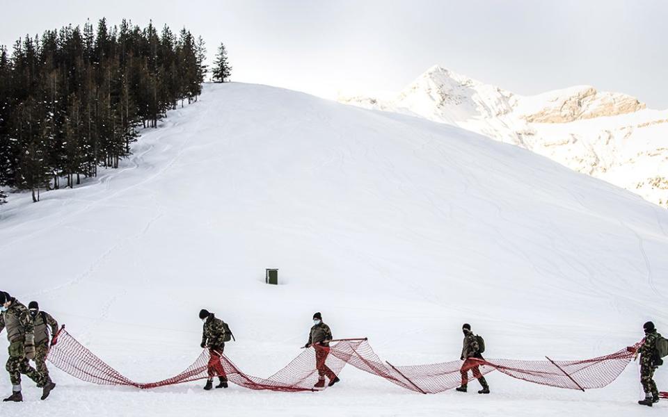 Swiss army troops have been brought in to help in Wengen, where the Lauberhorn race has been cancelled - Shutterstock