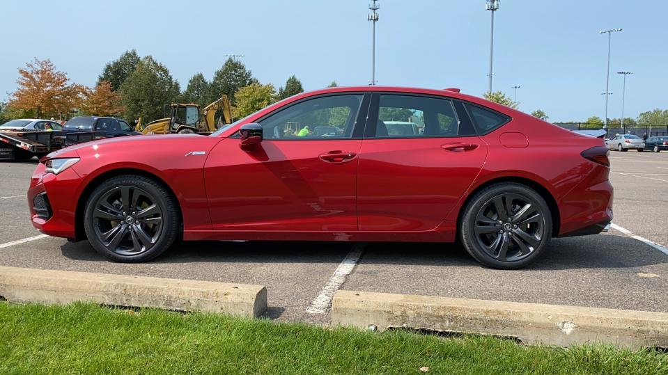 The 2021 Acura TLX's recognizable long nose and short rear deck.