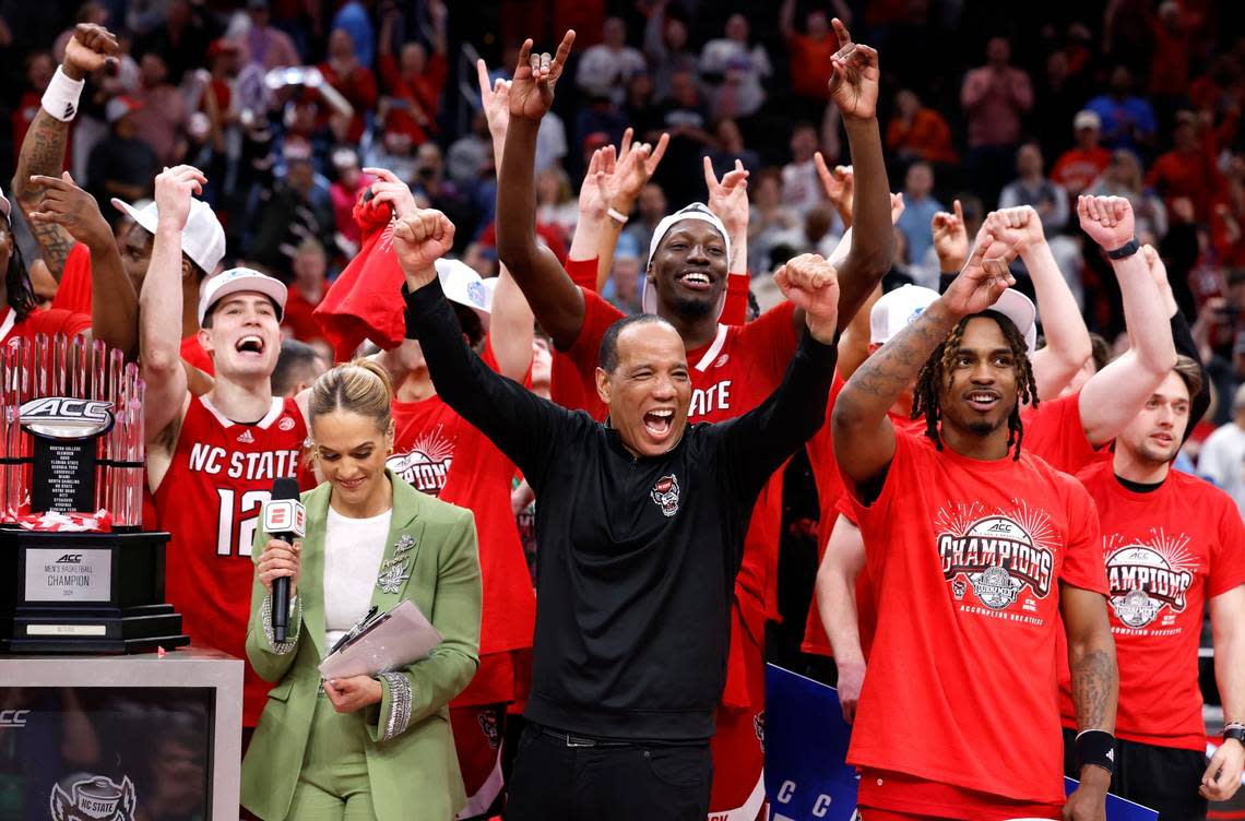 N.C. State’s head coach Kevin Keatts and the team celebrate as they come up to the podium after N.C. State’s 84-76 victory over UNC in the championship game of the 2024 ACC Men’s Basketball Tournament at Capital One Arena in Washington, D.C., Saturday, March 16, 2024.