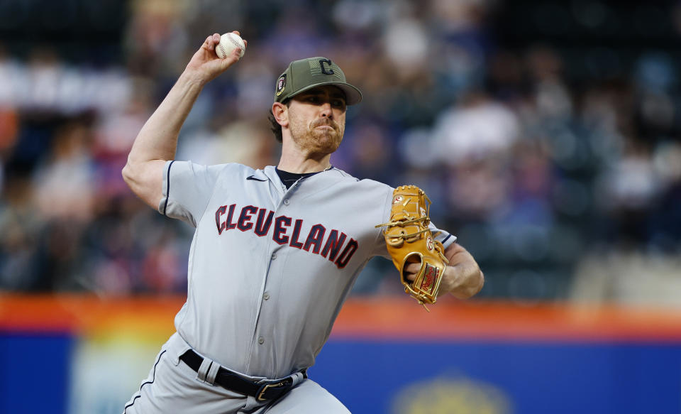 Cleveland Guardians starting pitcher Shane Bieber (57) throws against the New York Mets during the first inning of the second game of a split doubleheader baseball game, Sunday, May 21, 2023, in New York. (AP Photo/Noah K. Murray)