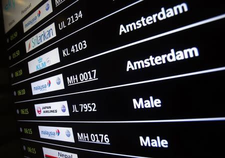 A screen showing arrival details of Malaysia Airlines flight MH17 (2nd from top) is seen at Kuala Lumpur International Airport in Sepang July 18, 2014. REUTERS/Samsul Said