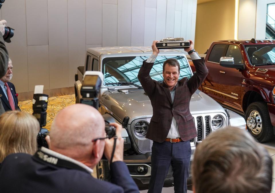 Jim Morrison Head of Jeep brand North America holds his award up for photographers after accepting the award for the 2020 North American Truck of the Year for the 2020 Jeep Gladiator at the TCF Center in Detroit on Monday, January 13, 2020.