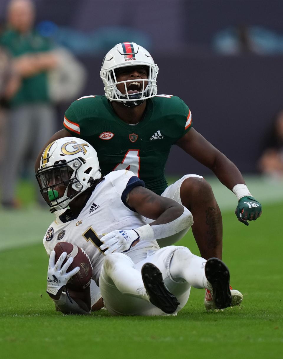 Hurricanes safety Keontra Smith reacts after tackling Yellow Jackets running back Jahmyr Gibbs.