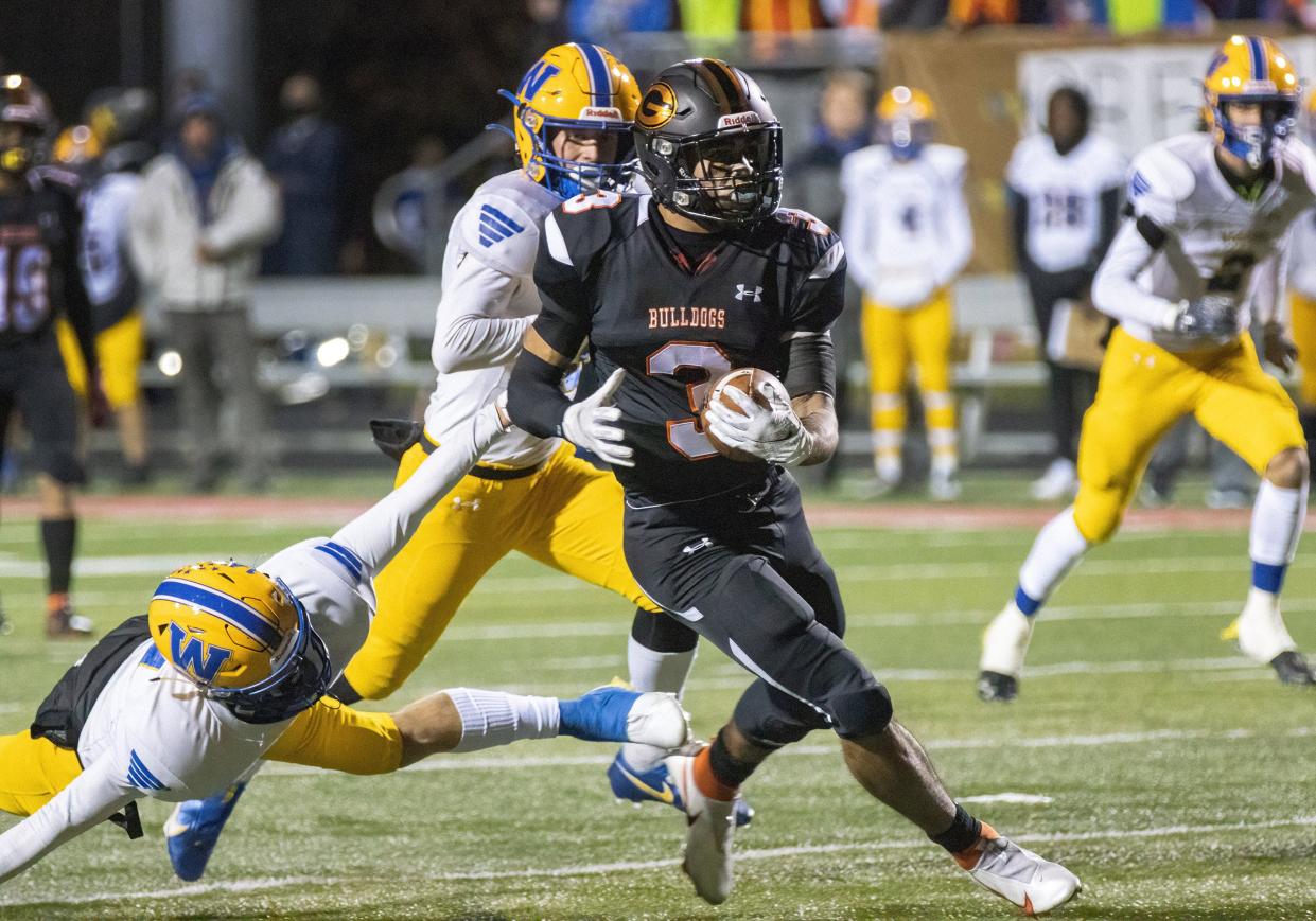 Green’s Trey Martin runs for his second touchdown against Wooster during the first quarter Friday, Nov. 12, 2021.