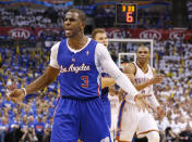 Los Angeles Clippers guard Chris Paul (3) complains to an official in front of Oklahoma City Thunder guard Russell Westbrook (0) in the third quarter of Game 2 of the Western Conference semifinal NBA basketball playoff series in Oklahoma City, Wednesday, May 7, 2014. Oklahoma City won 112-101. (AP Photo/Sue Ogrocki)