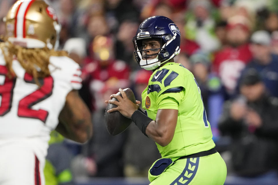 Seattle Seahawks quarterback Geno Smith throws during the first half of an NFL football game against the San Francisco 49ers, Thursday, Nov. 23, 2023, in Seattle. (AP Photo/Lindsey Wasson)