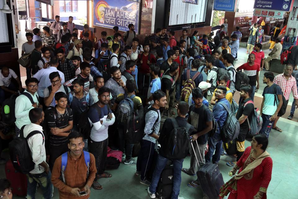 National Institute of Technology (NIT) students who left Srinagar, Kashmir's main city wait to leave for their respective homes at the railway station in Jammu, India, Sunday, Aug. 4, 2019. Thousands of Indian students and visitors were fleeing Indian-controlled Kashmir over the weekend after the government ordered tourists and Hindu pilgrims visiting a Himalayan cave shrine "to curtail their stay" in the disputed territory, citing security concerns. (AP Photo/Channi Anand)