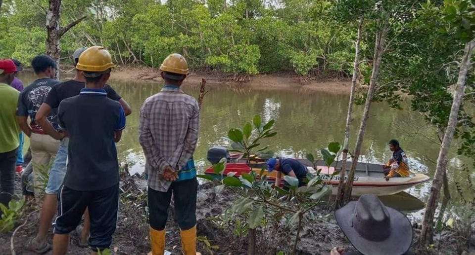 Rescue teams search for the body of the father-of-three who was eaten alive by a crocodile.