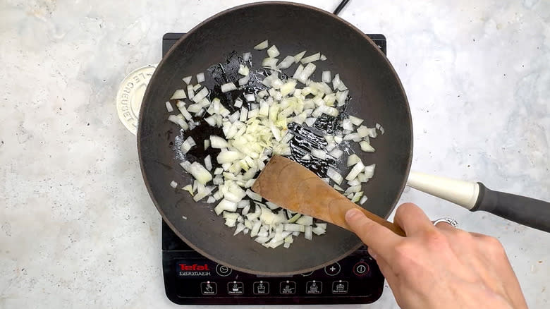 onion frying in pan