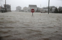 <p>Scituate Avenue in Scituate, Mass., is flooded during a nor’easter storm on March 2, 2018. (Photo: Jonathan Wiggs/The Boston Globe via Getty Images) </p>