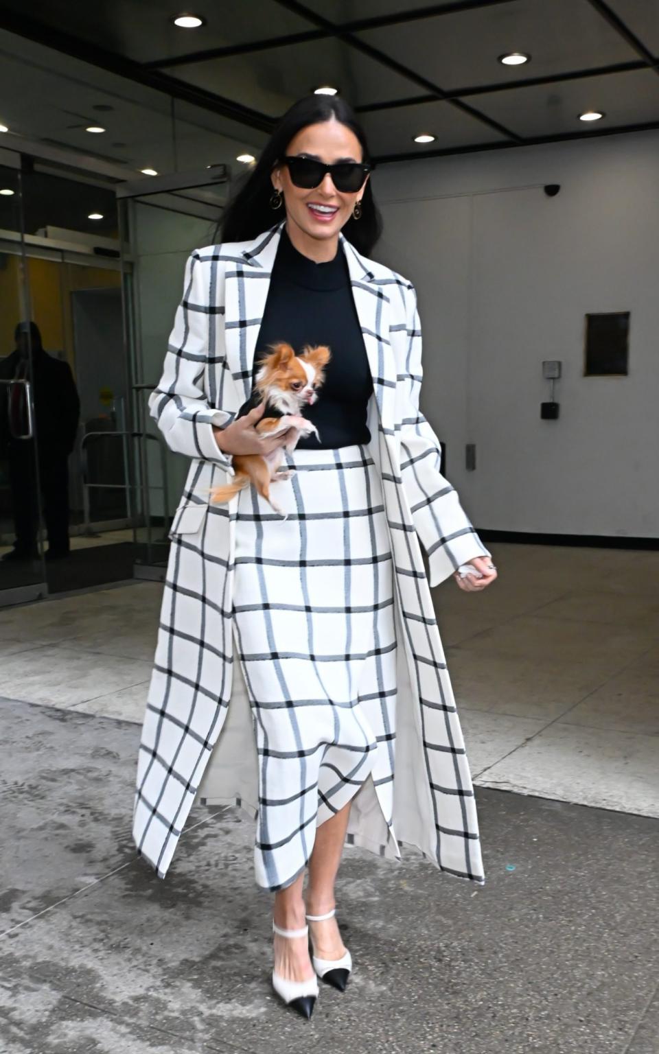 Few looks for Moore are complete without her favorite accessory: her chihuahua Pilaf