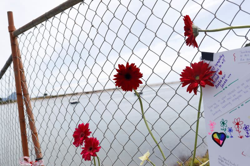 Flowers are seen at a memorial at the harbour in Whakatane, following the White Island volcano eruption in New Zealand