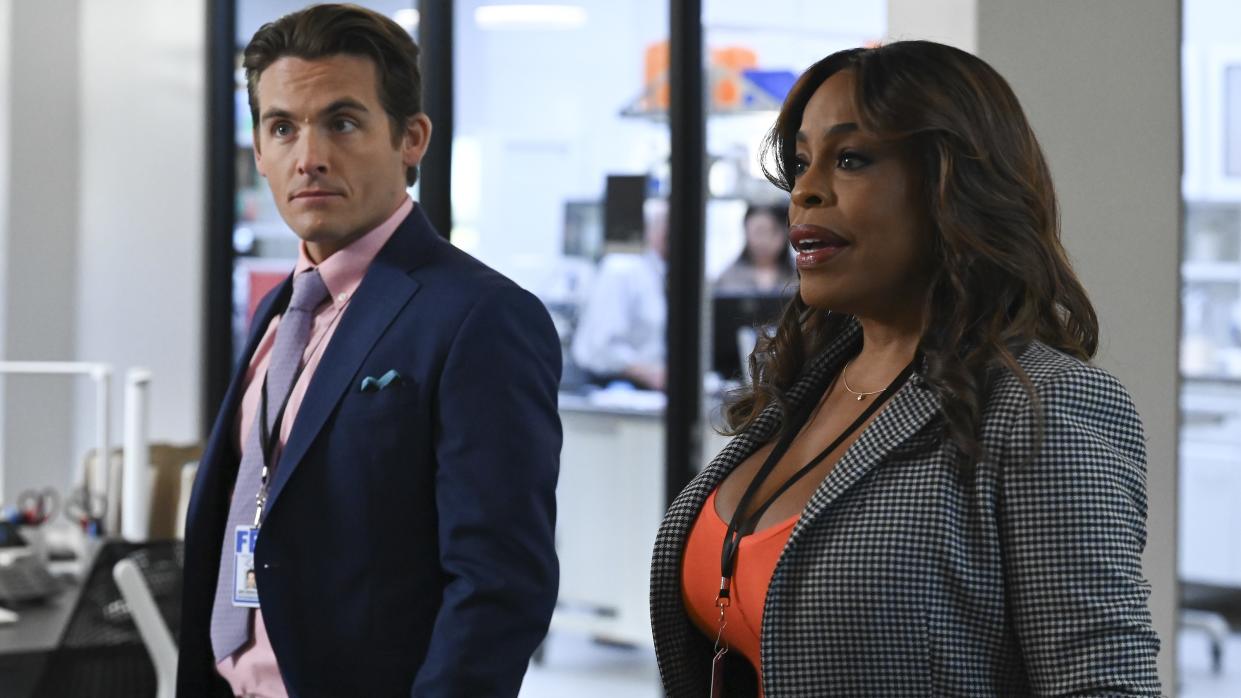 Kevin Zegers and Niecy Nash-Betts standing in an FBI office in The Rookie: Feds season 1 
