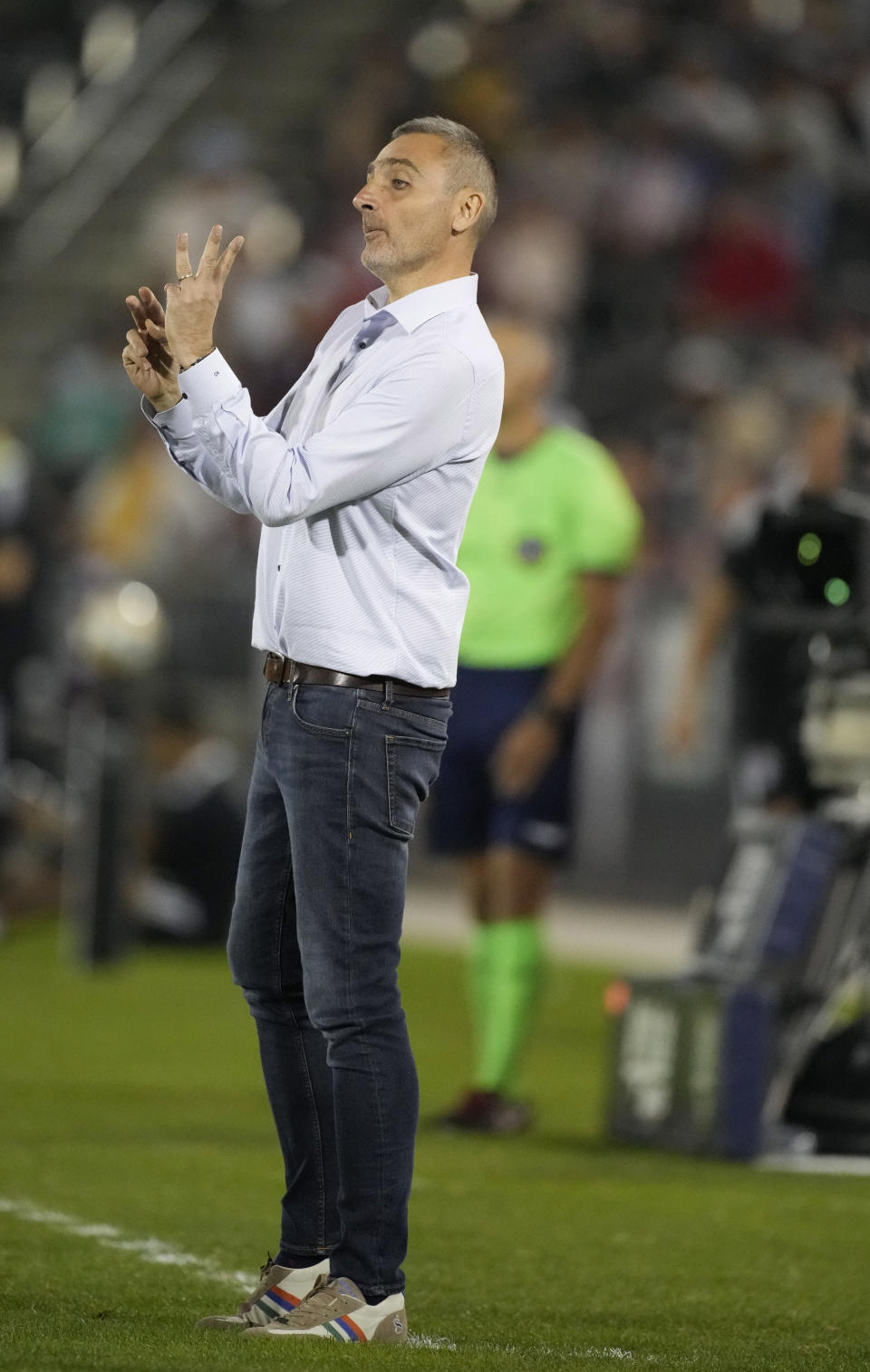 Vancouver Whitecaps head coach Vanni Sartini directs his team against the Colorado Rapids in the first half of an MLS soccer match Sunday, Sept. 19, 2021, in Commerce City, Colo. (AP Photo/David Zalubowski)