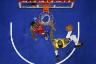 Los Angeles Lakers' LeBron James, right, puts up the ball with Philadelphia 76ers' Shake Milton, left, defending during the second half of an NBA basketball game, Saturday, Jan. 25, 2020, in Philadelphia. LeBron James passes Kobe Bryant for third on the NBA all-time scoring. (AP Photo/Chris Szagola)